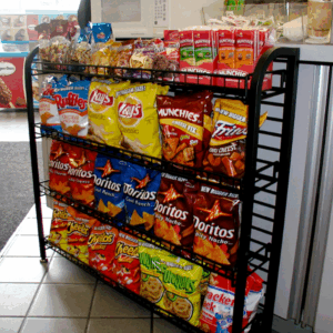 Black under counter wire display rack showcasing snacks in the store