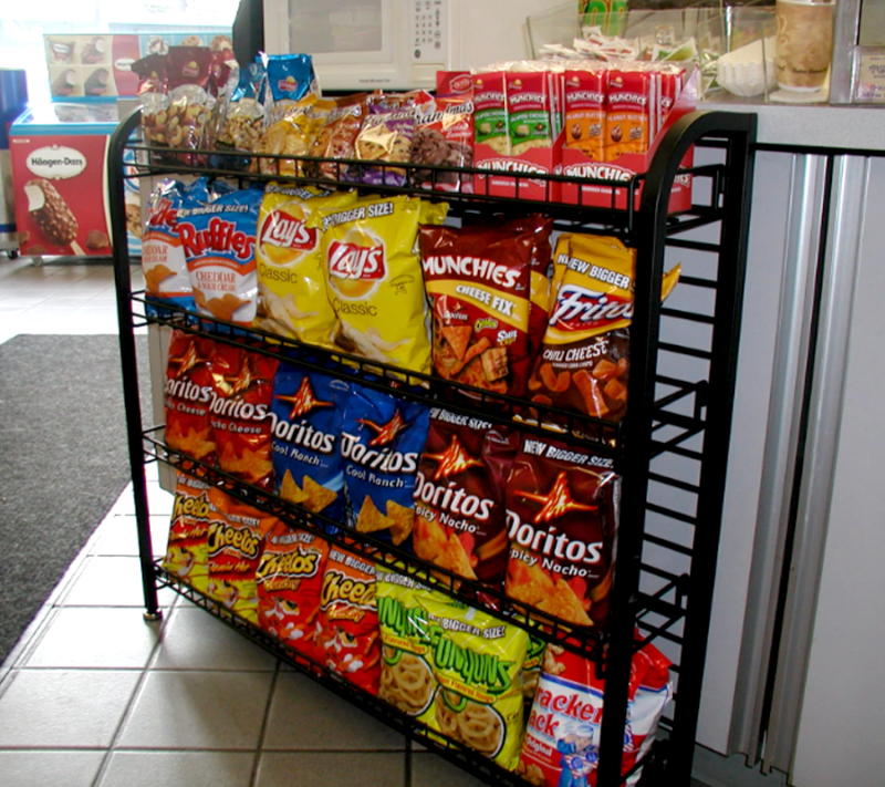 Black under counter wire display rack showcasing snacks in the store