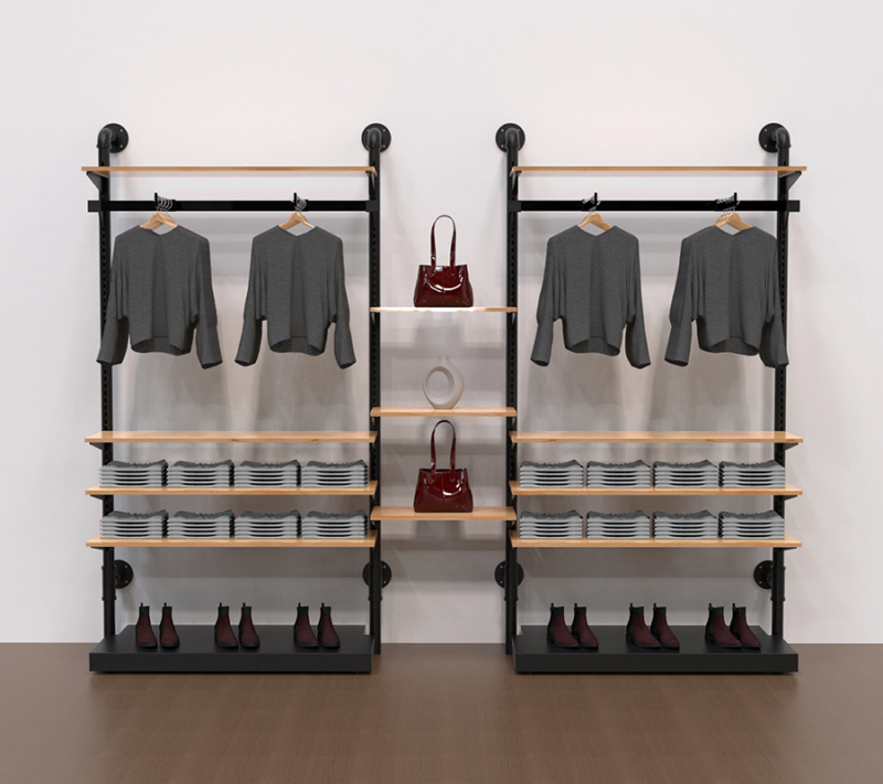 example set of our matte black pipline retail system with clothes hanging from the hangrail and wooden shelves to display clothes and Handbags and bases to display shoes.