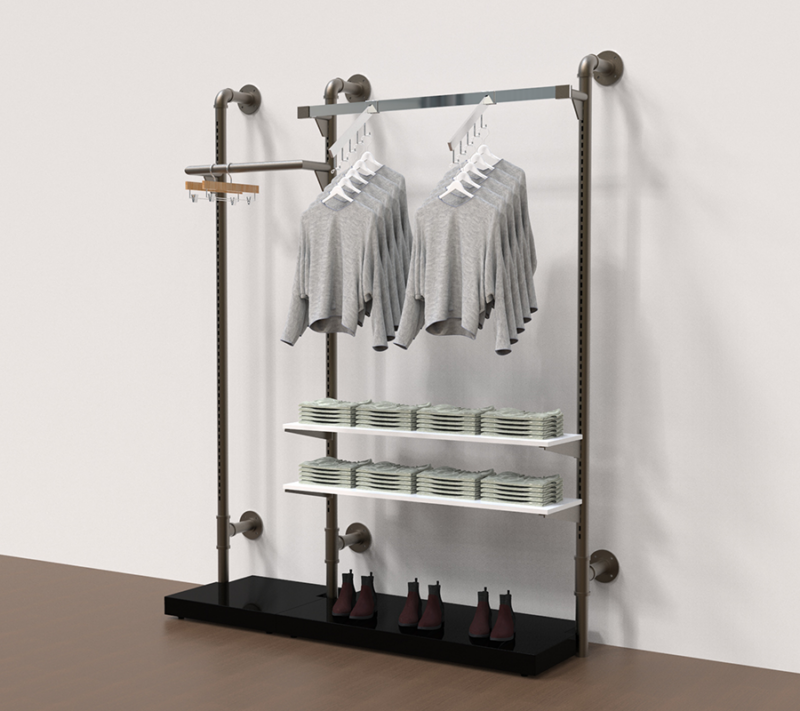 example set of our raw pipline retail system with clothes hanging from the hangrail and wooden shelves to display clothes and Handbags and bases to display shoes.