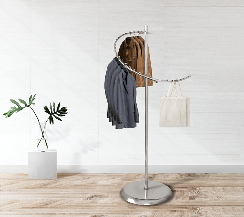 Chrome spiral garment apparel rack with clothes and bags modeled in an aesthetic ambiance