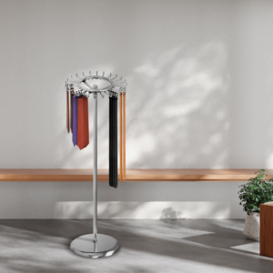 Chrome single tier revolving belt and tie rack with belts and ties modeled in an aesthetic ambiance